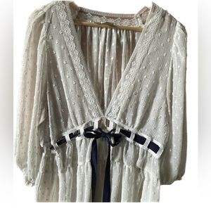 Listicle Bohemian cream flouncy top